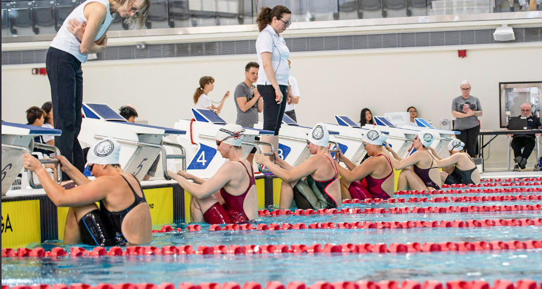 Medal haul doesn’t weigh down swimming duo